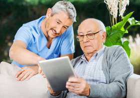 caregiver assisting senior man
